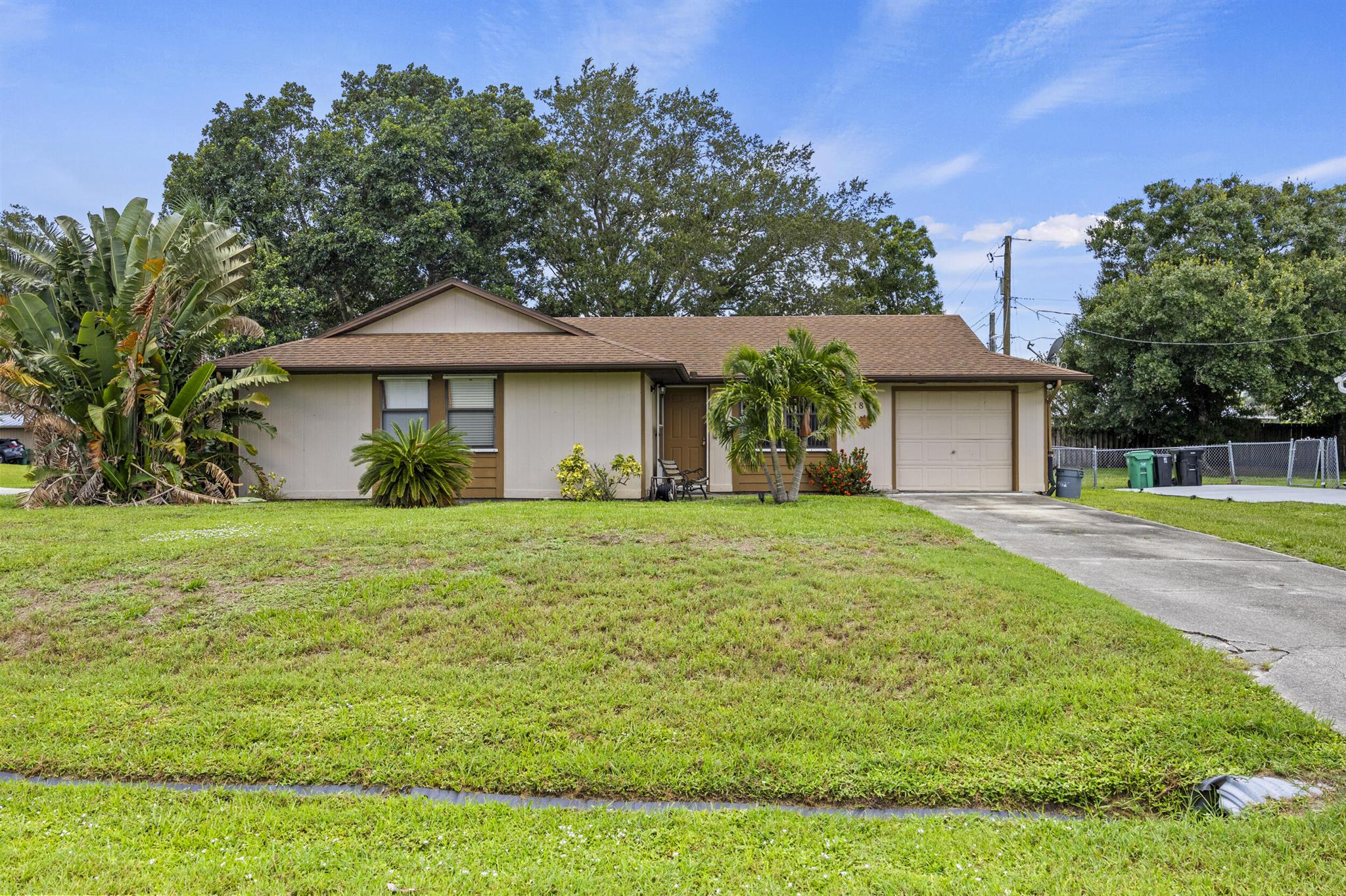 Corner lot, large fenced yard. Covered and screened back patio. Well kept.