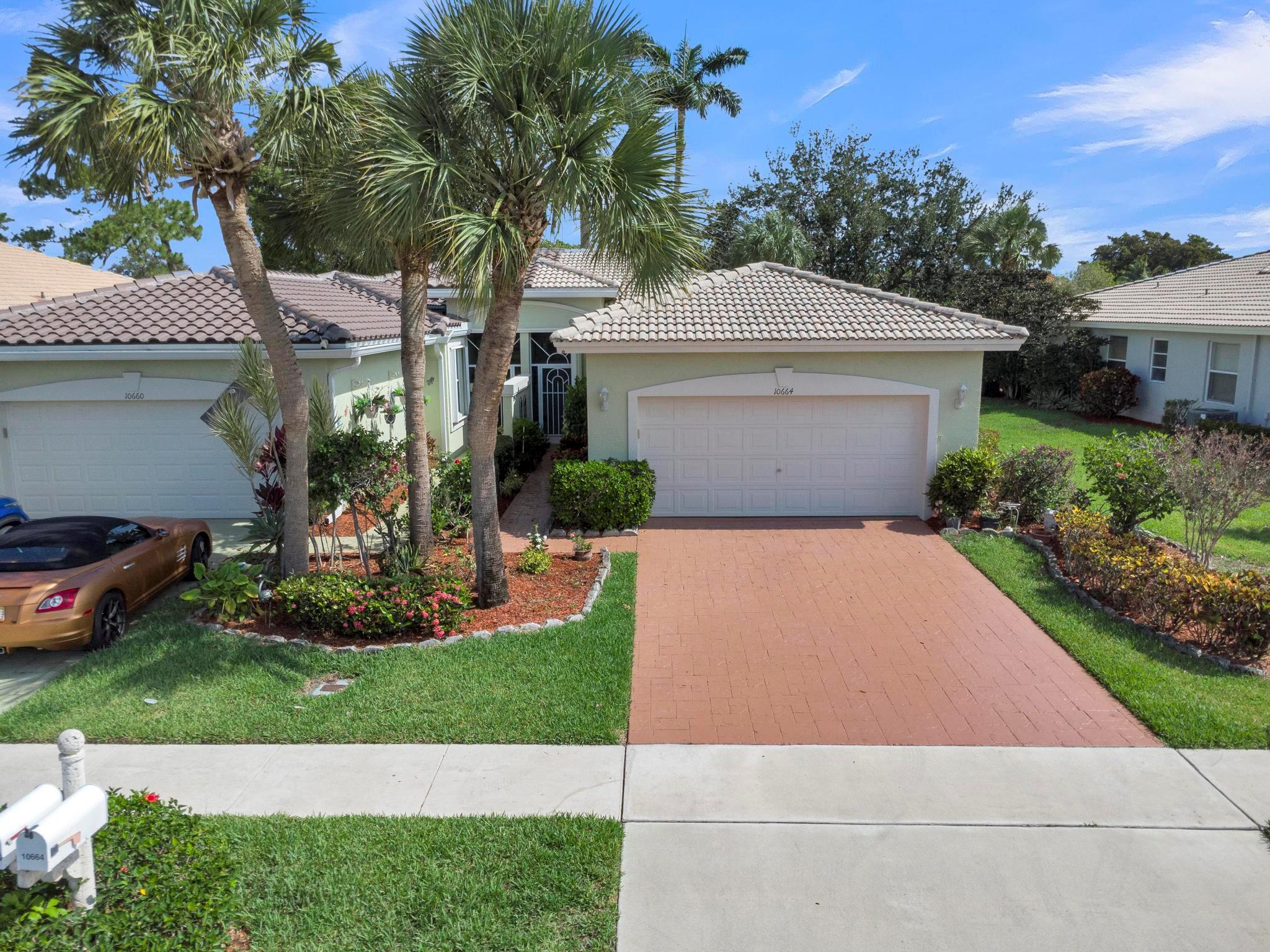 Welcome to Resort-Style Living in a Premier 55+ Guard-Gated Community Majestic Isles Discover the perfect blend of comfort, style, and convenience in this beautifully maintained villa, ideally situated in one of the area's most desirable 55+ communities. This spacious residence features three full bedrooms, two bathrooms, and an attached two-car garage, offering ample room for both relaxing and entertaining. Step inside to soaring vaulted ceilings in the expansive family and dining area, creating an airy, inviting atmosphere. The open-concept kitchen has been thoughtfully remodeled with stunning quartz countertops and seamlessly connects to the living space, ideal for hosting family and friends. Freshly painted interiors enhance the home's brightness, complemented by itsdesirable ..Cont