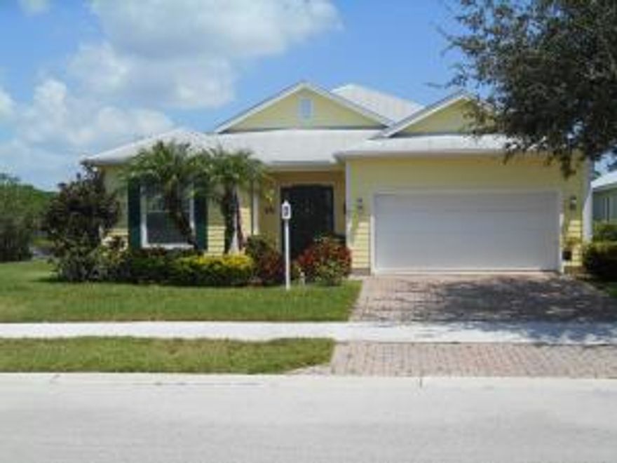 Don't miss this pristine waterfront home, surrounded by a natural preserve. This home boasts of wood floors, tile, carpet in bedrooms and a metal roof. Neutral colors; some rooms newly painted. 3rd BR is den w/Pocket French doors-no closet. Large eat-in kitchen with sliders leading to a large screened patio. Beautiful living/formal dining area. Kitchen, LR, Master BR all overlook lake. Unique community of Key West style homes located on the north end of the St Lucie River with ocean access. Features include power boat launch/ramp, canoe/kayak launch, fishing dock, hiking trails, boat/RV storage, community pool/spa, children's play ground,Soccer /softball fields,clubhouse, exercise room, basketball & volleyball courts, park with outdoor grills,activity & meeting rooms, sidewalks and street lights.Low HOA Fees includes lawn maintenance, cable & community amenities.