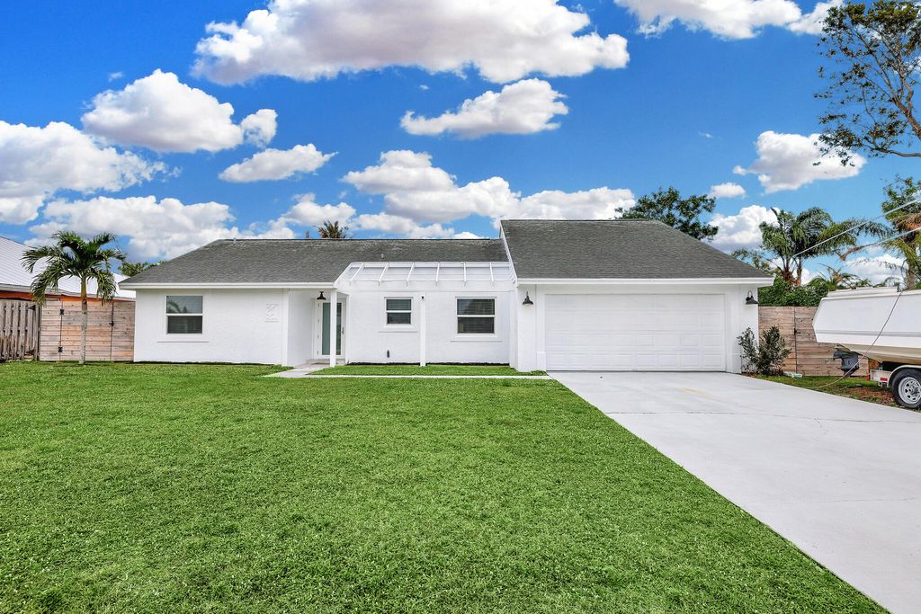 Photo of 5646 SE Sailfish Way, Stuart, FL 34997 (MLS # R11054125)