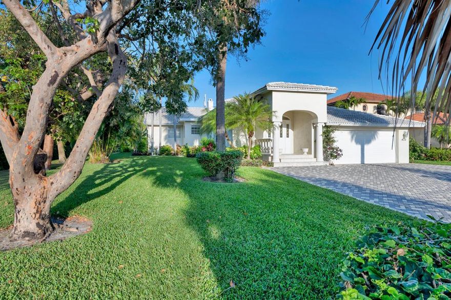 The sale on this fabulous, one-story 4/4.5 home on Hypoluxo Island fell though. The price has been reduced. Located only blocks from the ocean and shopping, it features an open floor plan -- with lots of natural light --, wood flooring, a higher elevation., heated pool and wood burning fireplace. Desirable corner lot facing the park. All four bedrooms have ensuite baths. There is also a separate office or TV room -- and a storage room by the pool. 1 1/2 - car garage.  Priced low because the house will need a new roof. Sold furnished.