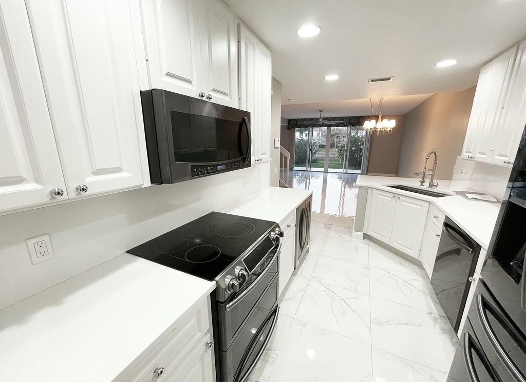 Photo of 134 Santa Barbara Way, Palm Beach Gardens, FL 33410 (MLS # R11061494)