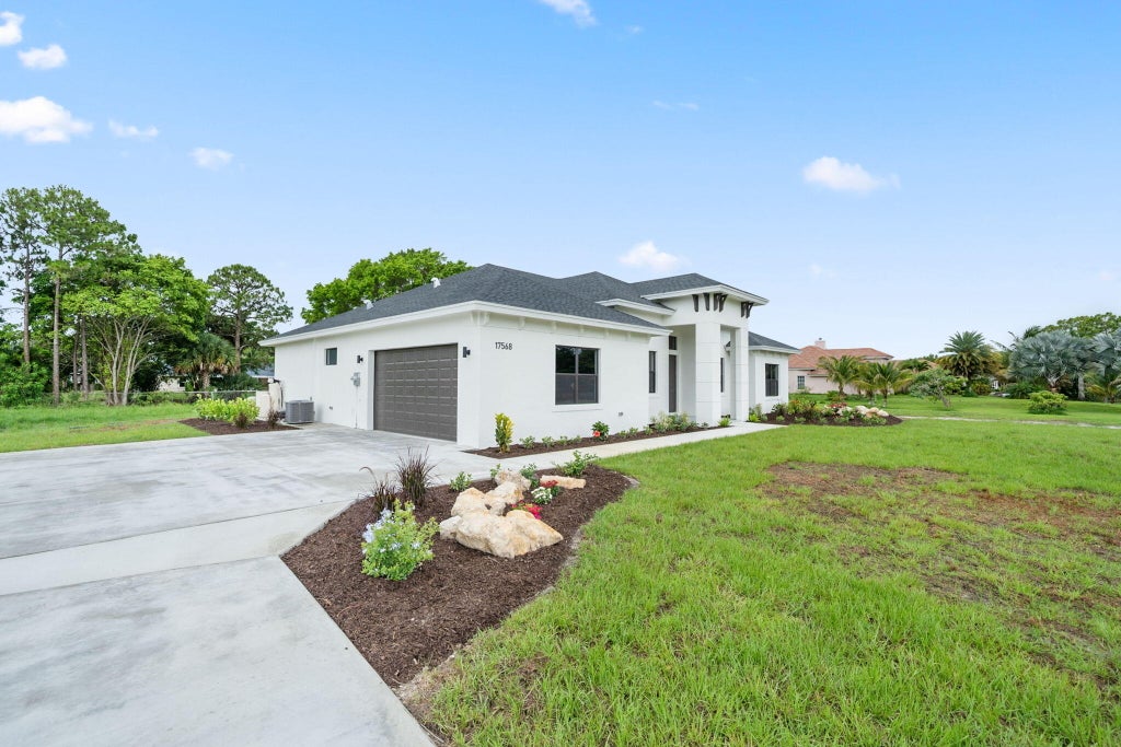 Photo of 17568 Valencia Boulevard, The Acreage, FL 33470 (MLS # R10996535)