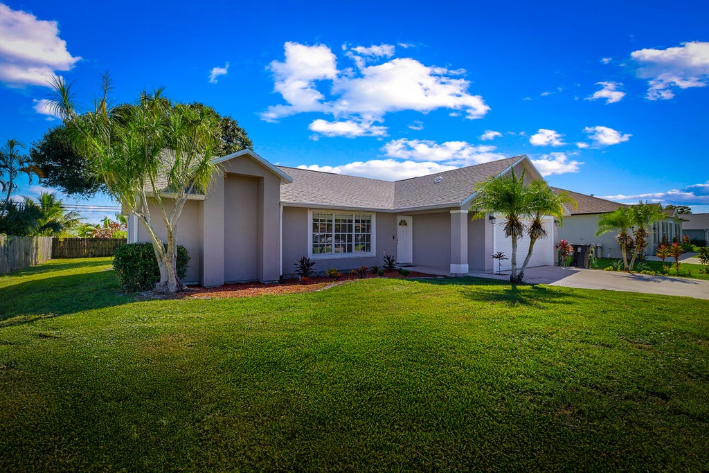 Photo of 1232 SW Wellington Avenue, Port Saint Lucie, FL 34953 (MLS # R11126075)