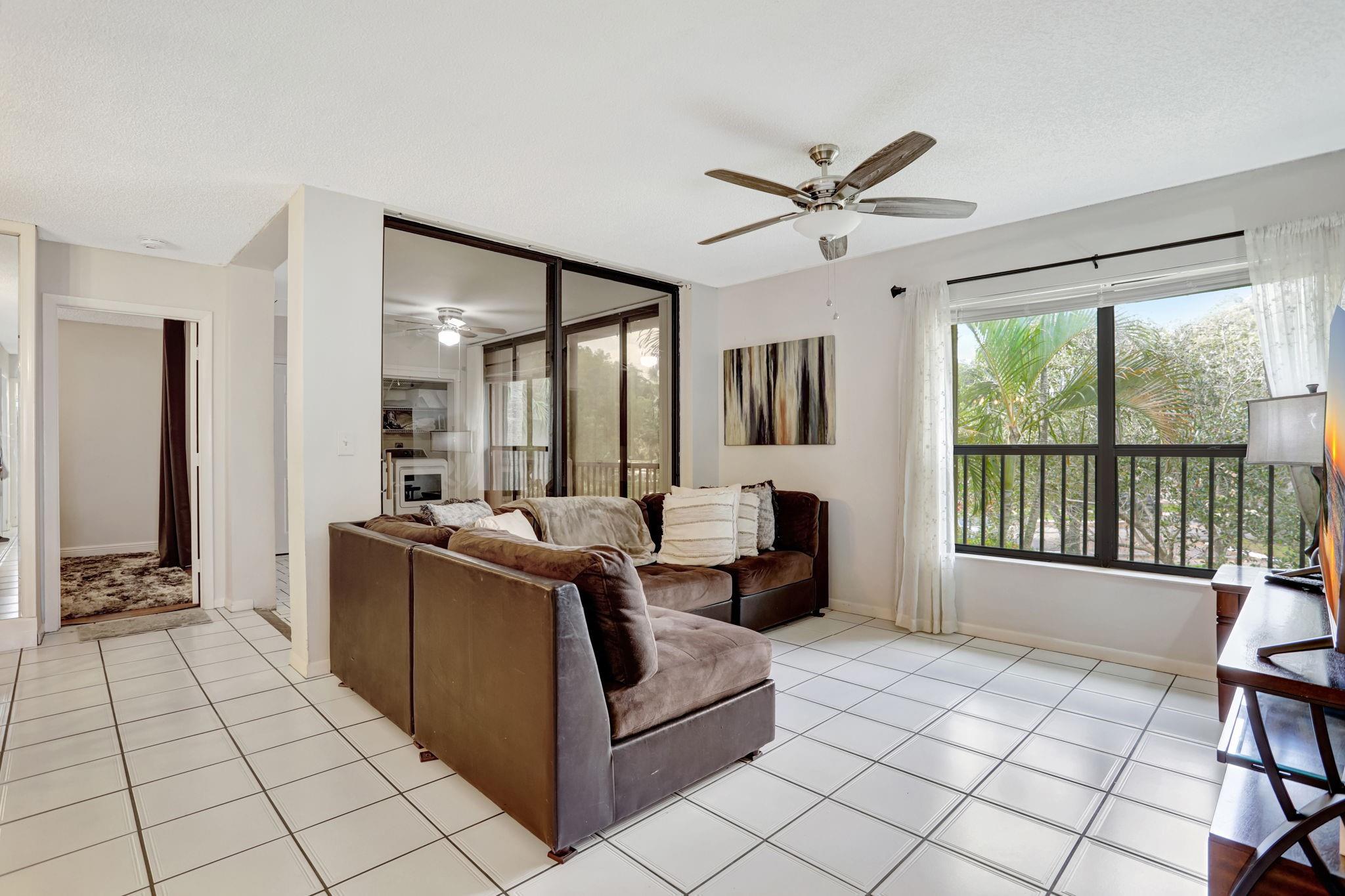 PRICED TO SELL at $274,900, this 3-bedroom condo in Applewood Village 2 in The Township offers incredible value, featuring a 4th bonus room and access to resort-style amenities. This unit features wood and tile flooring, hurricane shutters, and a Florida room with an A/C vent that can also serve as a versatile 4th bonus room for extra living space. Updates:2023 A/C and 2018 water heater. Washer & Dryer included! HOA dues cover water, cable, internet, exterior building insurance, roof maintenance, trash, and sewer. Residents enjoy top-tier amenities, including a theatre, aquatic center, fitness room, tennis and pickleball courts, and a basketball court. Easy access to Florida’s Turnpike, I-95, and Sawgrass Expressway.