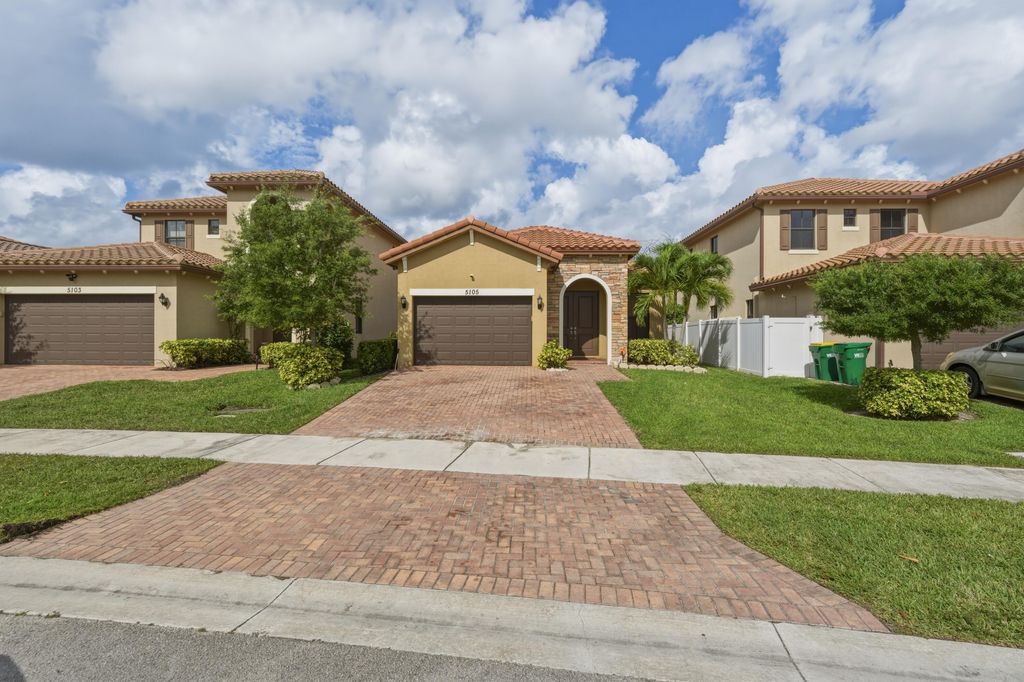 Photo of 5105 NW 51st Terrace, Tamarac, FL 33319 (MLS # B26011239)