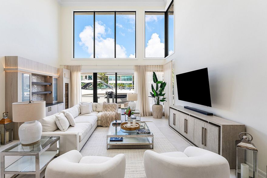 This Impeccably Renovated 5BDRM, 5.1BA Waterfront Residence Presents a Rare Opportunity to Own a Luxurious Waterfront Estate within one of Boca Raton's Most Prestigious Gated Enclaves. Every Detail has been Thoughtfully Designed to Balance Architectural Luxury and Presence.  The Residence Opens Seamlessly to Expansive Living and Dining Areas where Soaring Ceilings and Walls of Floor-to-Ceiling Windows Infuse the Interiors w/ Natural Light with Water Views from all Main Living Areas.  A Beautifully Appointed & Exceptionally Designed Kitchen supports Everyday Living and Elevated Entertaining. The Home's Intelligent Floorplan includes a Private Office, a Dedicated Movie Theater, and an Integrated Entertainment Bar, including a Wine Cooler & Ice Maker, Ideal for Effortless Hosting. Through a Private Courtyard Entry, the Residence Reveals a Resort-Style Outdoor Sanctuary Featuring a Heated Saltwater Pool and a Fully Equipped Summer Kitchen. A Separate Guest House with a Full Bath and Mini-Fridge Provides Exceptional Flexibility and Privacy for Visiting Family and Friends.  Hurricane-Rated Impact Glass and a Full-House Generator Ensure Year-Round Peace of Mind.
This rare turn-key opportunity comes move-in ready, with furniture and boat negotiableallowing you to step into the complete Florida lifestyle from Day 1.