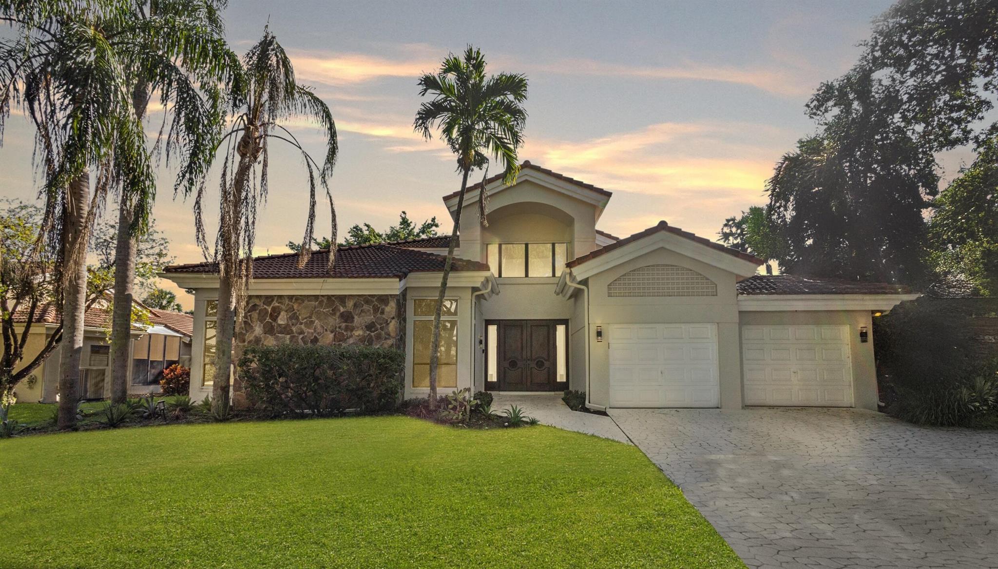 Welcome to Colonnade living in the heart of Boca Raton. This stunning 4 bed, 3.5 bath home boasts soaring ceilings, a bright open layout, and a beautifully updated primary bath with spa-like finishes. Enjoy a private backyard oasis with pool and spa, perfect for entertaining. The expansive layout offers flexibility for work or play. Additional highlights include a sleek cooktop, wall oven, central A/C, panel shutters, and attached garage. Located in a sought-after community with tennis, fitness trail, and playground. Just 8 minutes from Town Center at Boca Raton, parks, and top-rated schools.