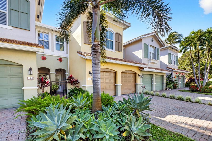 Welcome to a townhouse that lives & feels like a private home!  Just a short stroll from the Intracoastal Waterway, resort-style pool & PRIVATE BEACH, this spacious residence is a rare find! Ideally situated in the desirable center section, it offers an oversized, secluded back yard with an expansive patio that can accomodate all your entertaining needs or a quiet cup of coffee in the morning, Inside you'll find thoughtful upgrades throughout- french doors, plantation shutters, impact glass windows, NEW ROOF, & a screened lanai to capture the coastal breezes. The cozy den offers an ideal spot to relax or use as an office. The breathtaking primary suite is a true retreat, boasting a soaring ceiling, separate sitting area, & a walk-in closet the size of a small room!  The primary bathroom