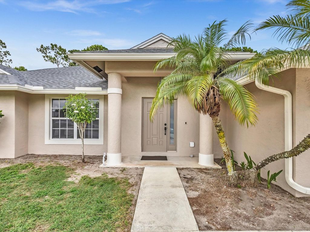 Photo of 1581 SW Delos Avenue, Port Saint Lucie, FL 34953 (MLS # F10450866)