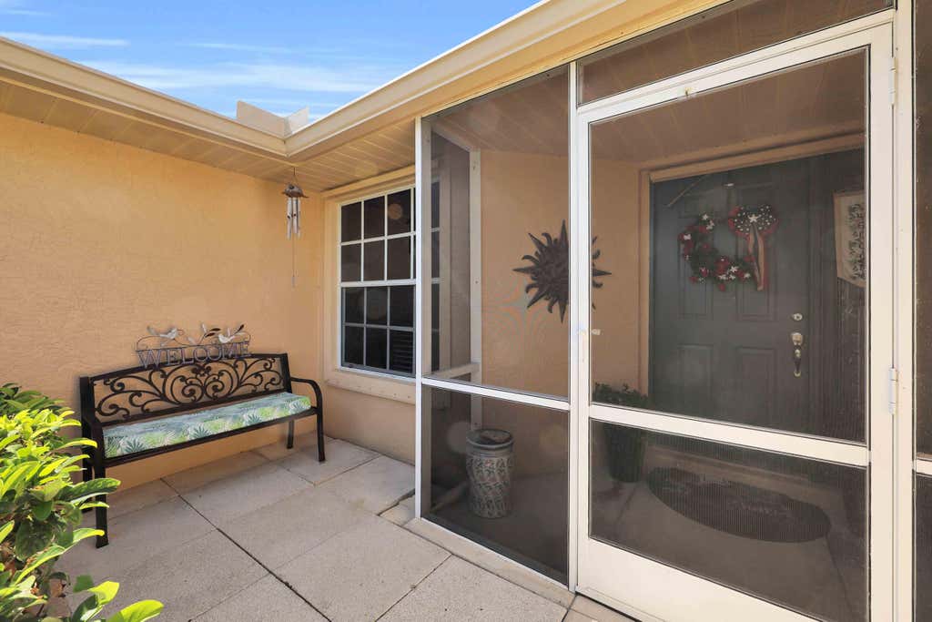 Photo of 481 NW Riverside Drive, Port Saint Lucie, FL 34983 (MLS # B26029012)