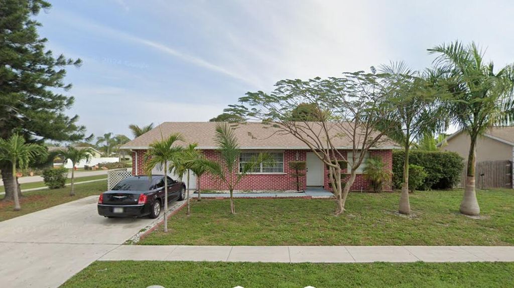 Photo of 118 Bobwhite Road, Royal Palm Beach, FL 33411 (MLS # B26035423)