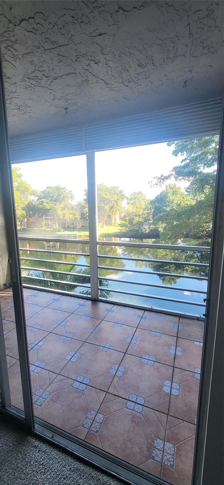 55+ community offering a variety of amenities such as a lakefront pool, Jacuzzi, playroom, clubhouse with stage, ballroom, tennis, and more; perfect for active and social living. There is a second pool conveniently located next to the building. This unit has a relaxing lake view and an extra storage room on the same floor. The windows in the bedroom and kitchen are impact windows. This community only requires one resident to be 55 or older; spouses and children 18+ are welcome. 55+ community offering a variety of amenities such as a lakefront pool, Jacuzzi, playroom, clubhouse with stage, ballroom, tennis, and more; perfect for active and social living. There is a second pool conveniently located next to the building. This unit has a relaxing lake view and an extra storage room on the same floor. The windows in the bedroom and kitchen are impact windows. This community only requires one resident to be 55 or older; spouses and children 18+ are welcome.