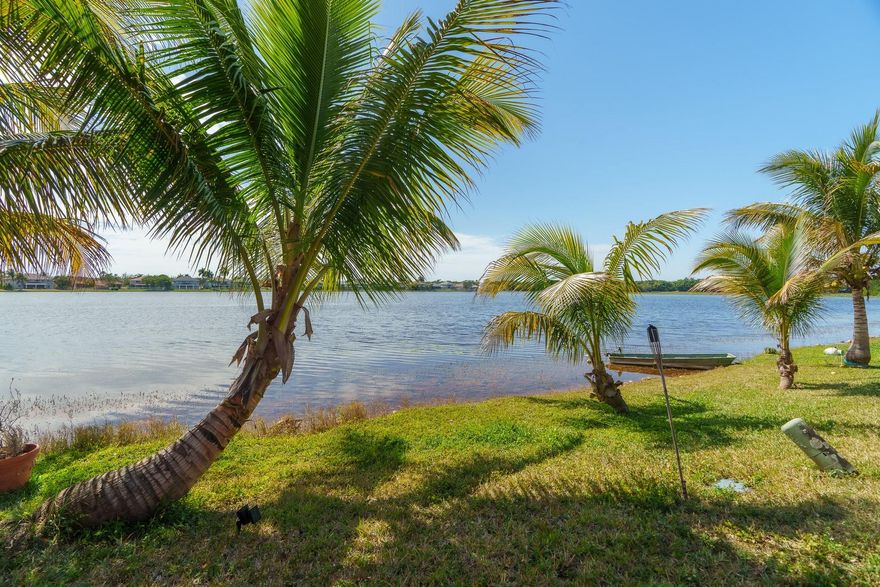 Waterfront living at its finest!!  Stunning 180 degree lake views as far as the eye can see provide a perfect landscape for incredible sunsets every evening!!  Enjoy the view from the massive screened in patio with enough room for the whole family to enjoy, or set up a hammock in between the palm trees and just enjoy the peace and quiet. Vaulted ceilings + Perfect open concept floor plan + Upgraded kitchen with stainless steel appliances & gorgeous granite counter tops.  LVT flooring throughout the living areas. Excellent Weston school district!! Short walk to the community pool + kids playground!! Short drive to the beach!! ***Investor friendly*** Can rent right away.. No rental restrictions.