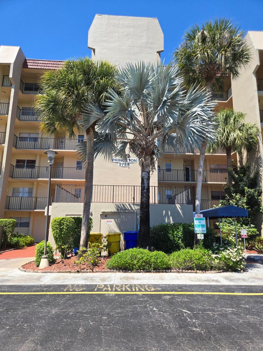 Enjoy easy living in this bright and open first floor condo featuring wide open living and dining areas ideal for both relaxing and entertaining. The home is beautifully appointed with impact windows, laminate flooring, plantation shutters, and silhouette window shades that create a polished, comfortable atmosphere. You'll love the two large walk in closets, indoor laundry area, and newer appliances throughout for true convenience. Step through the patio doors to your private outdoor space overlooking scenic golf views, the perfect spot for your morning coffee or evening unwind. A wonderful combination of style, function, and serenity—all in one move in ready home. Relax at home or take advantage of a very active 55+ community featuring Mel's Bistro for food and entertainment, large pool,  clubhouse, tennis, pickleball, fitness center, movies, and pay as you play golf, no costly membership fees. Enjoy all that the West Palm Beach has to offer in beaches, entertainment, restaurants, airports, and shopping