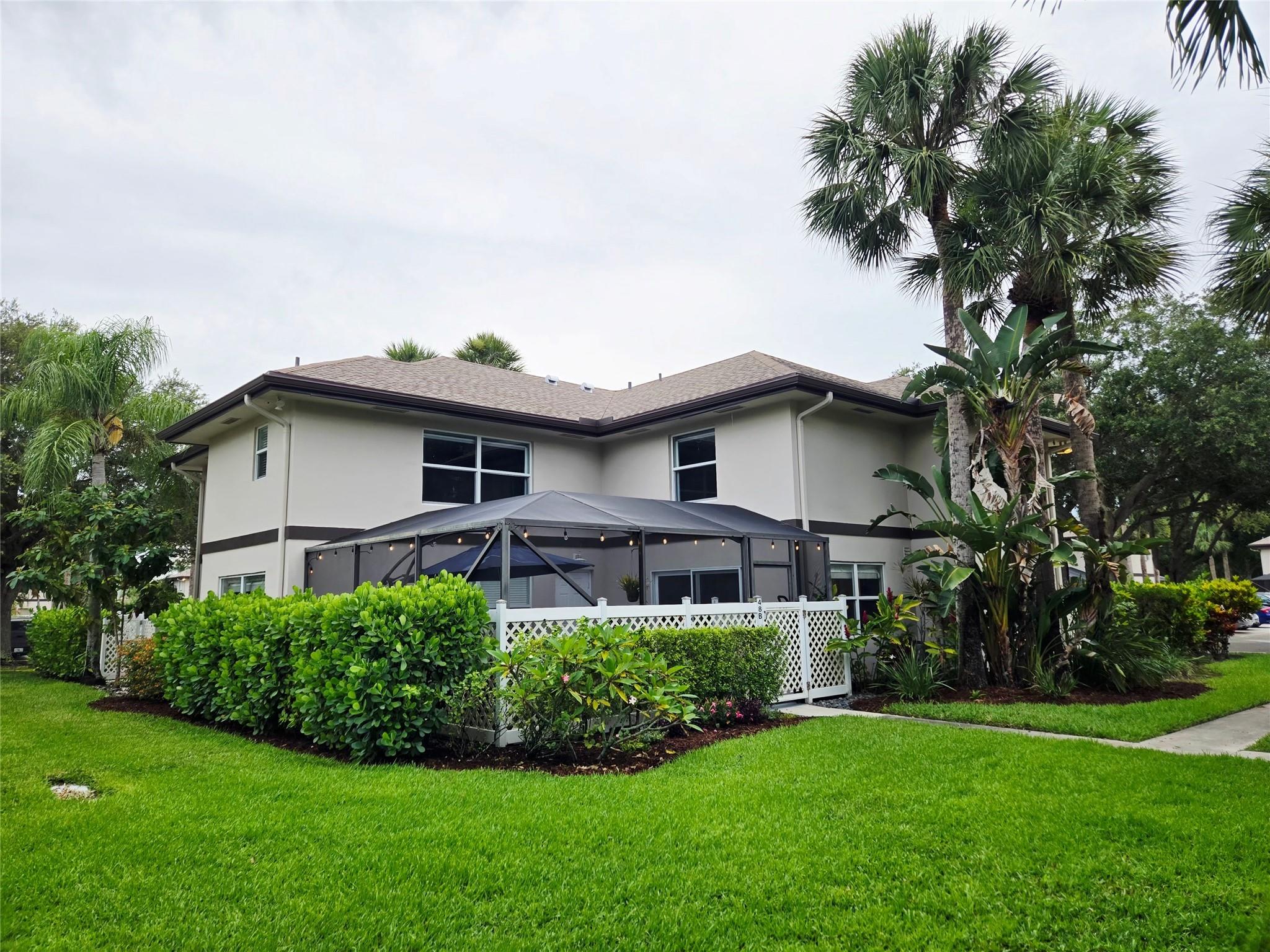 Welcome to the beautiful STAMFORD AT ROYAL PALM BEACH! Gorgeous 2 bedroom 2 1/2 bathroom complete turn key home with upgrades you will see in a million dollar home! Walking in, you will be greeted by a fairly new screened in patio area perfect for barbecuing and comfortable patio seating. First floor tiled throughout resembling wood flooring. Living room flowing into the custom kitchen with beautiful back splash, crown molding, soft closing doors and quartz counter tops. Ceiling has custom installed flush LED lighting on dimmers with lighting under the cabinets as well. Half bath shares its space with the laundry room with Samsung washer/dryer that stays! Custom closets and bathrooms upstairs you will want to see in person. A/C only 2 yrs old. Roof replaced 2024.