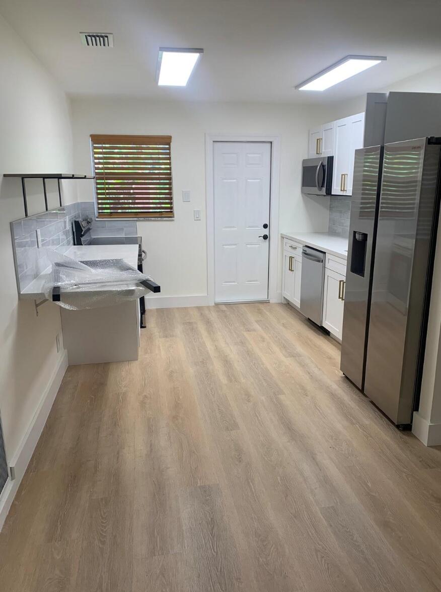 Photo of 2889 SW 19th Place #A, Fort Lauderdale, FL 33312 (MLS # B26064160)