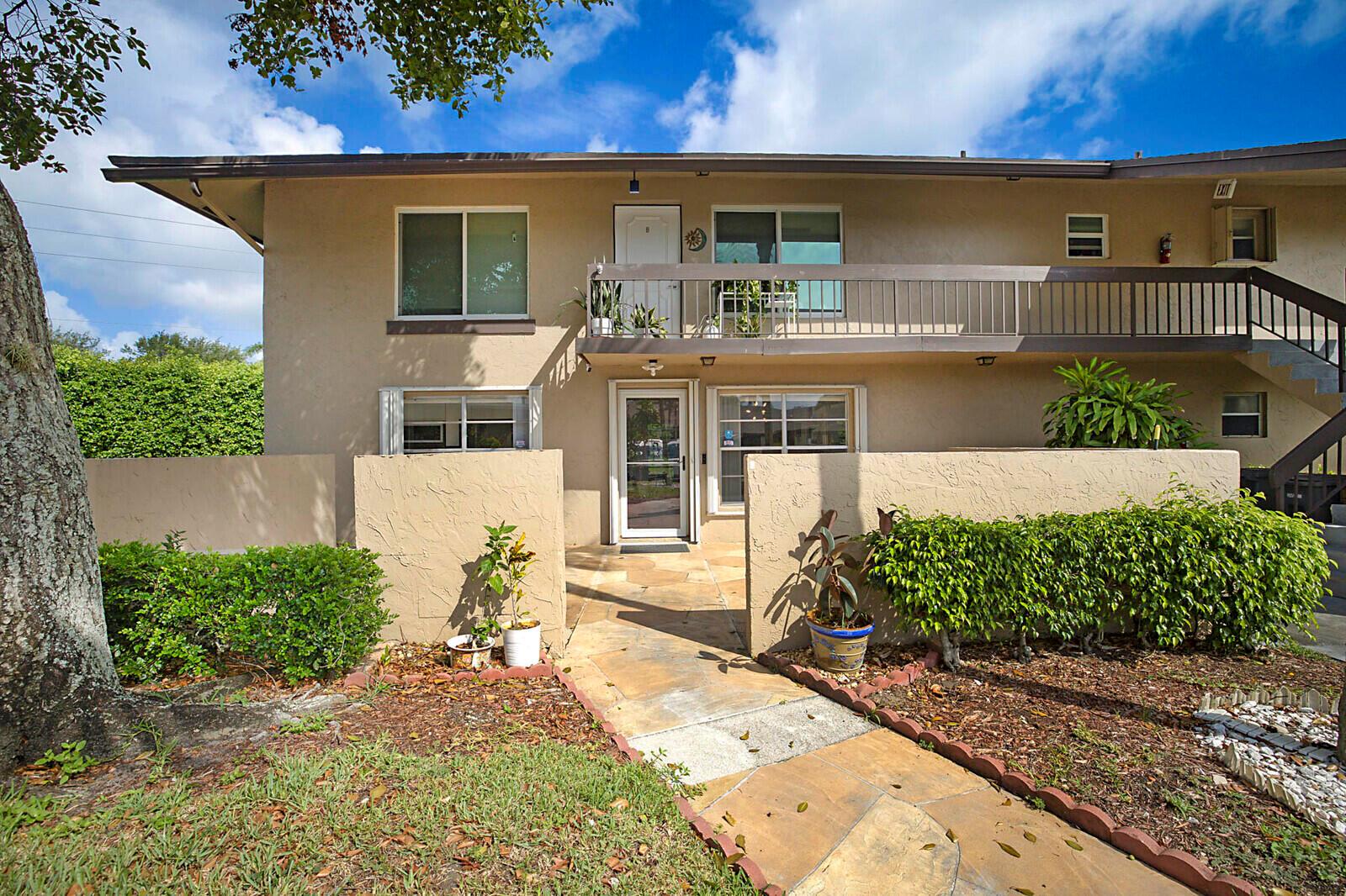 Beautifully Updated First-Floor Condo in Desirable Palm Greens! Step into easy Florida living with this meticulously maintained and stylishly updated 2-bedroom, 2-bathroom condo in the heart of Palm Greens. This bright and inviting first-floor unit offers a perfect blend of comfort, style, and convenience. Enjoy al fresco dining on your spacious, private front patio, or start your mornings in the peaceful, fully enclosed back patio/Florida room. Inside, you'll find neutral white tile flooring throughout and a new kitchen with white cabinetry, new Samsung appliances, and plenty of counter space -- perfect for casual meals or entertaining. Both bathrooms have been tastefully updated, including the master en-suite which features a new vanity, high-seat commode, and a modern walk-in shower.