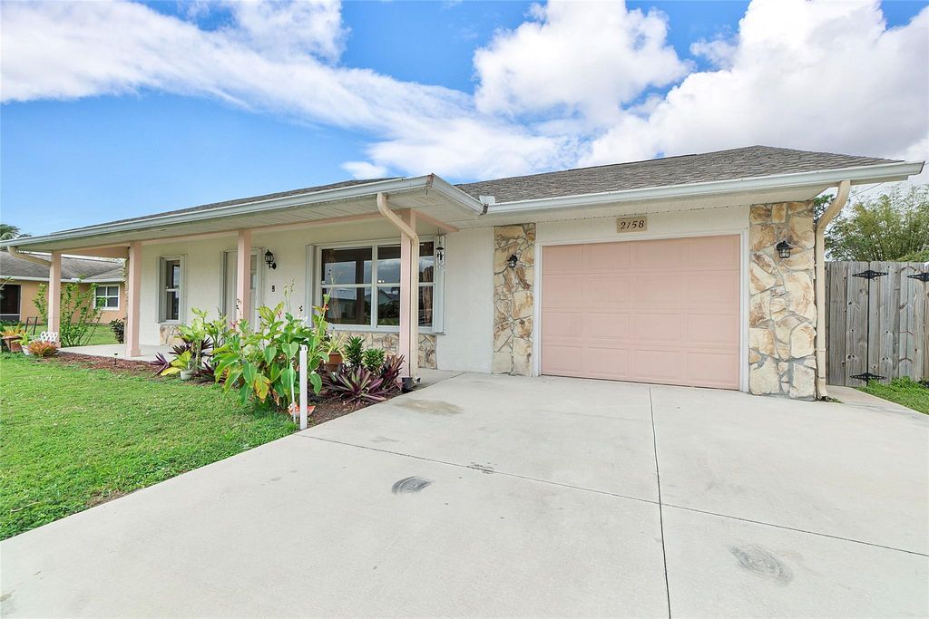 Photo of 2158 SE Carnation Road, Port Saint Lucie, FL 34952 (MLS # F10423594)