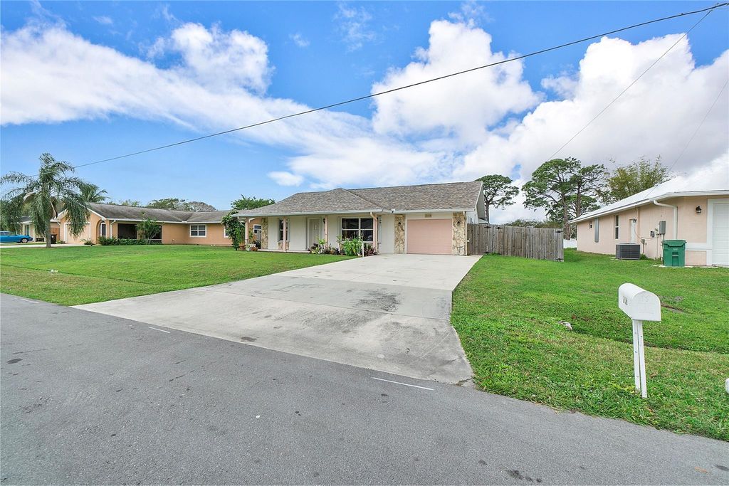 Photo of 2158 SE Carnation Road, Port Saint Lucie, FL 34952 (MLS # F10423594)