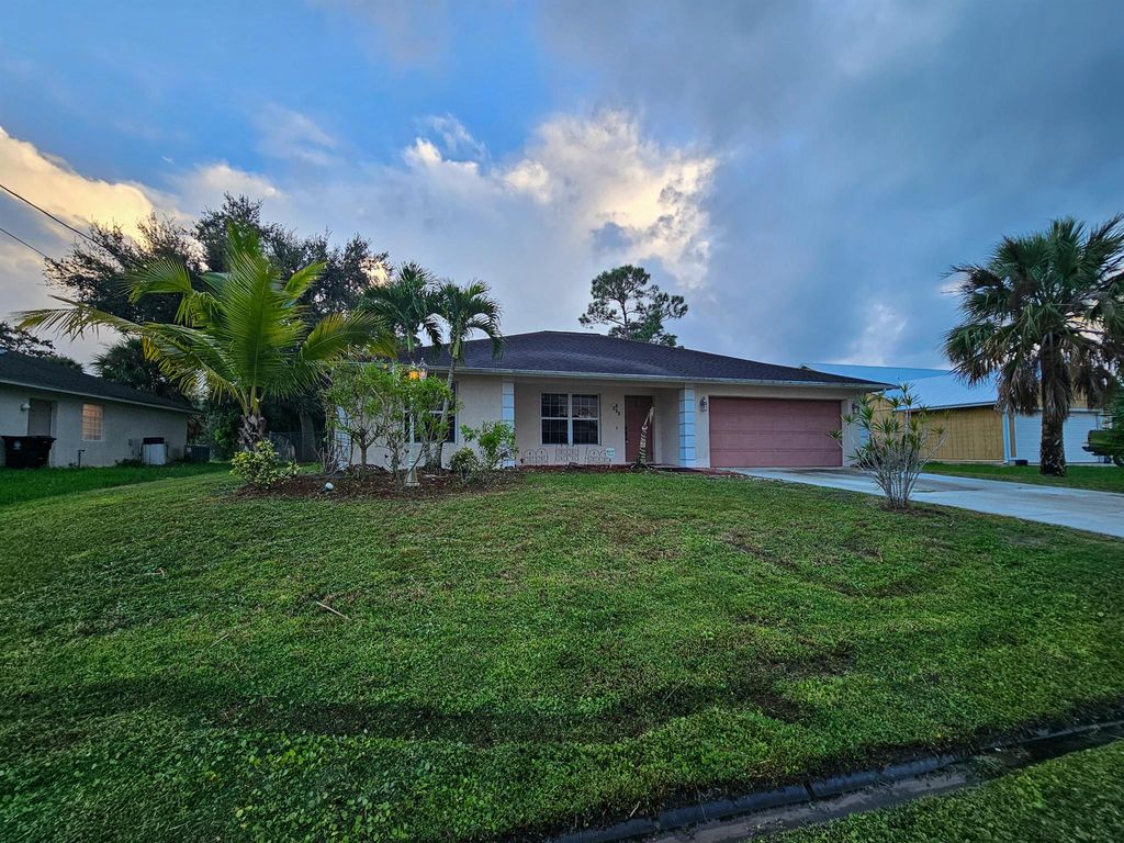 Photo of 1110 SW Sudder Avenue, Port Saint Lucie, FL 34953 (MLS # R11130067)