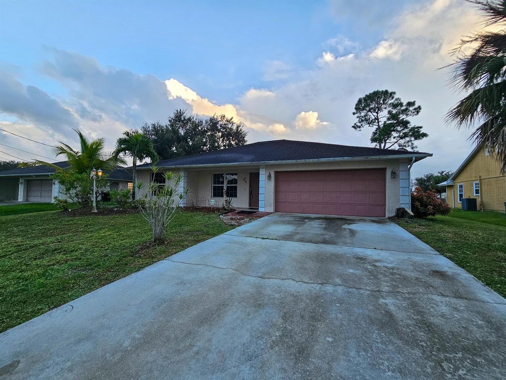 Photo of 1110 SW Sudder Avenue, Port Saint Lucie, FL 34953 (MLS # R11130067)