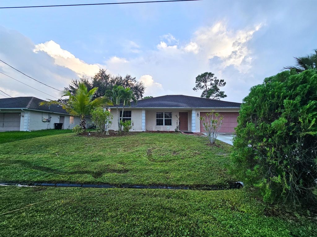 Photo of 1110 SW Sudder Avenue, Port Saint Lucie, FL 34953 (MLS # R11130067)