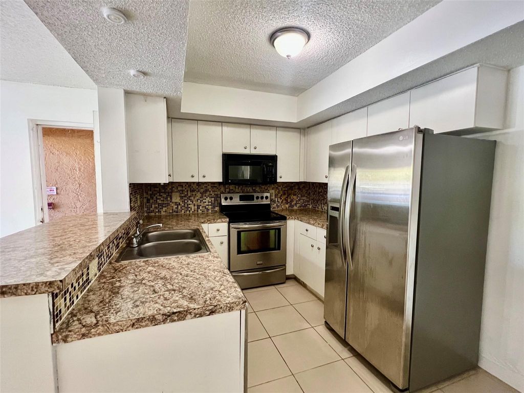 Photo of 5530 NW 61st Street #306, Coconut Creek, FL 33073 (MLS # F10471721)