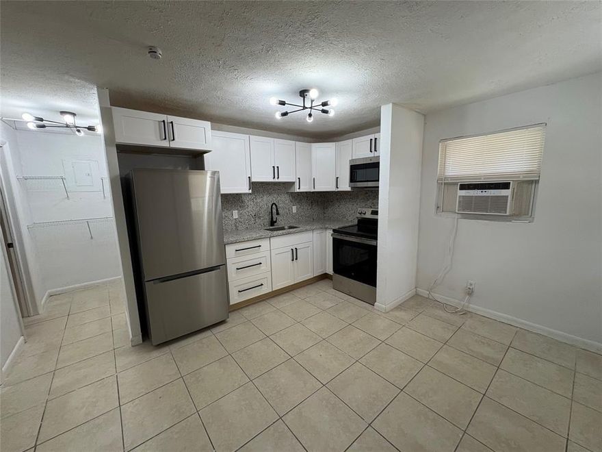Renovated 2/1 unit in the heart of Boynton Beach, two minutes from the I-95. Modern kitchen with a granite countertop and brand-new stainless-steel appliances including a washer. New light fixtures all around. Bathroom has a new vanity and bathtub. Large back yard