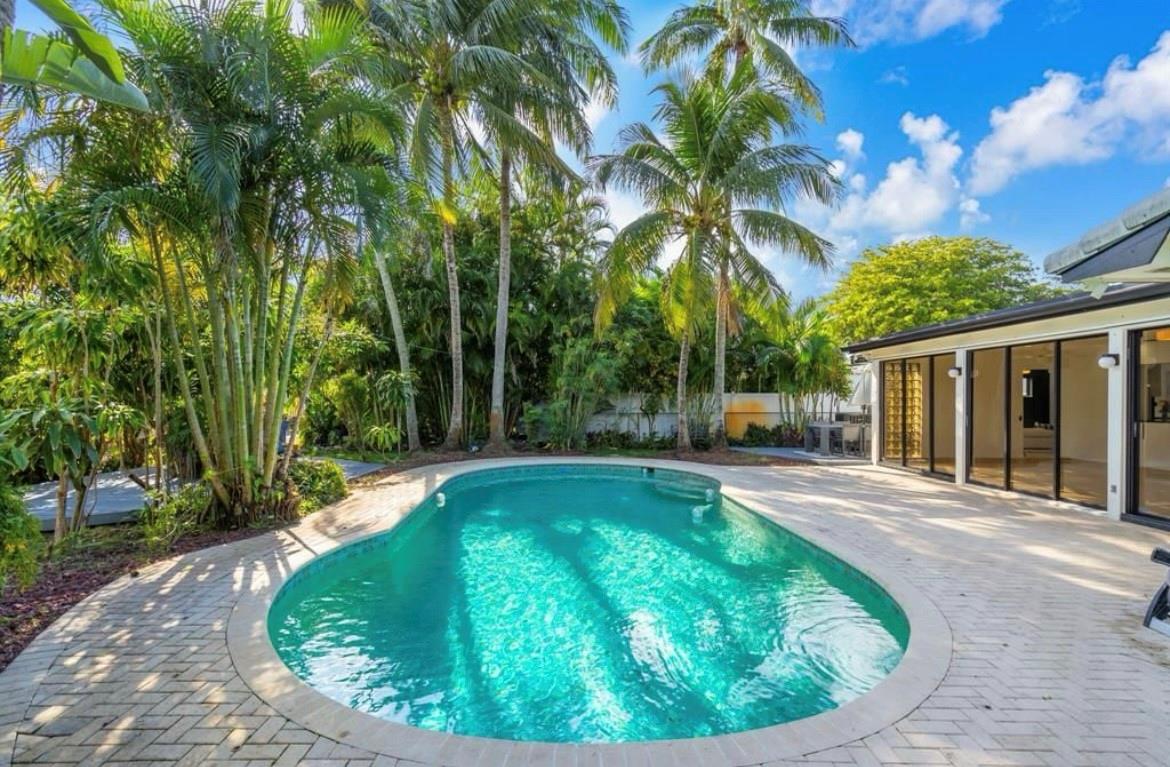 Wonderful New Renovation! Gorgeous Heated Pool Home in Hollywood Hills. Minutes to Beaches, FLL/MIA airports,Casino's & Dania Point restaurants and shopping. New Flooring,New Kitchen,New Bathrooms. Fabulous Floor Plan. Huge Florida room full of natural light, facing a tropical back yard with a heated pool and 2 decks for outdoor entertaining. 3 large bedrooms & 2 newly renovated bathrooms. Large custom closet in the primary bedroom. Custom flooring throughout this modern home with 3 open living areas full of natural light. 2 car garage with A/C, great for office or gym. New Water Heater& A/C ducts, New kitchen with custom granite countertops and backsplash. Top of the line Stainless Appliances. Huge 10,103ft lot . THIS IS FLORIDA LIVING! See it today!