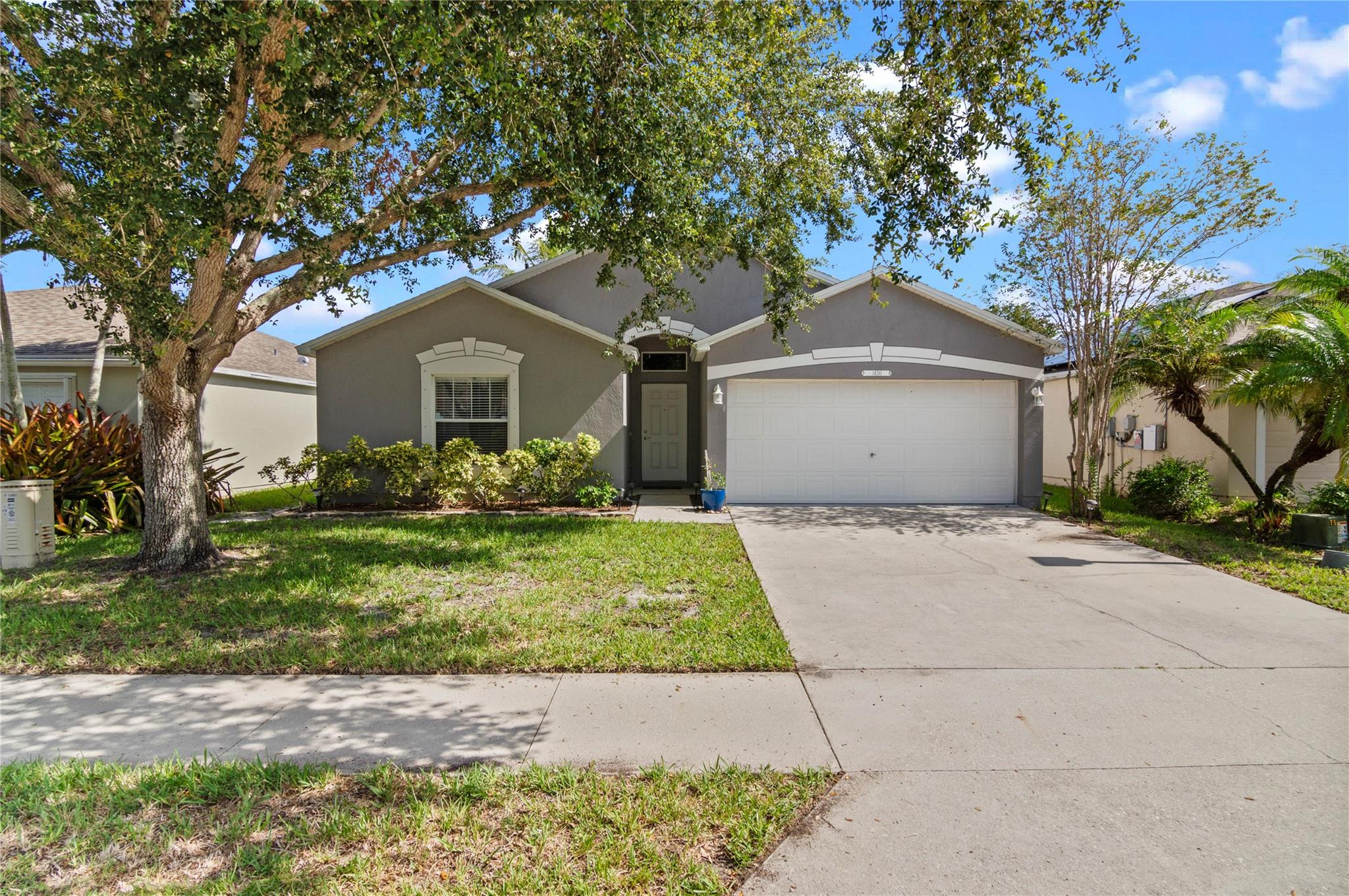 Welcome home to this renovated 3BR/2BA lakefront residence! Open concept floor plan with tile floors throughout main living area and upgraded kitchen and bathrooms! Vaulted ceilings in the main living area and plenty of natural light make this home bright and airy. Kitchen is equipped with quartz countertops, LG appliances and a large island! Two dining areas provides ample space to entertain. Tastefully renovated, including 2023 roof & 2019 hot water heater. Screened in patio with plenty of room to expand or add a pool. Full storm protection. Waterford Lakes is in a great location, close to all shopping and the beaches. Lawn care included in HOA!