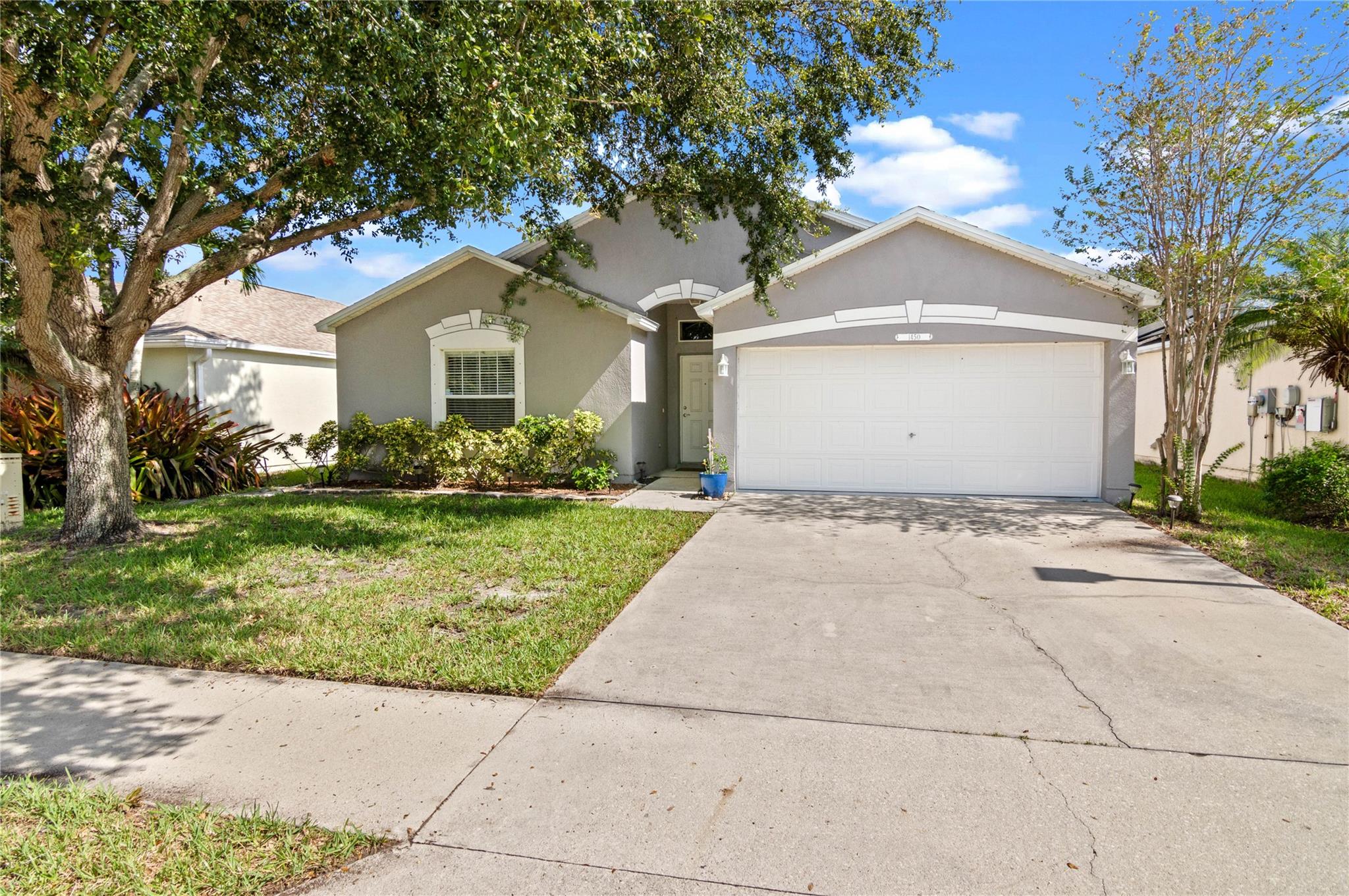 Welcome home to this renovated 3BR/2BA lakefront residence! Open concept floor plan with tile floors throughout main living area and upgraded kitchen and bathrooms! Vaulted ceilings in the main living area and plenty of natural light make this home bright and airy. Kitchen is equipped with quartz countertops, LG appliances and a large island! Two dining areas provides ample space to entertain. Tastefully renovated, including 2023 roof & 2019 hot water heater. Screened in patio with plenty of room to expand or add a pool. Full storm protection. Waterford Lakes is in a great location, close to all shopping and the beaches. Lawn care included in HOA!