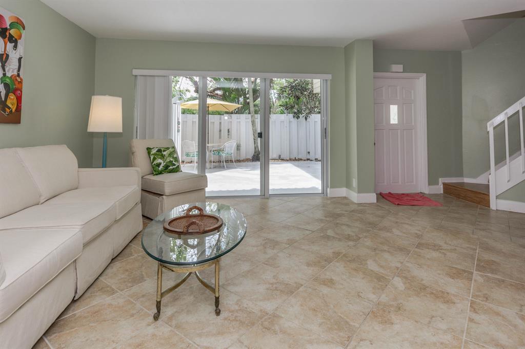 Welcome to your beach house! If you have been dreaming of a beachy lifestyle, this is it! With deeded beach access, you are approx a 1/4 mile walk to the beach as well as Carlin Park. Surrounded by pristine nature trails and preserves as well as Shopping, dining and cultural attractions such as Jupiter's Maltz Theater, a movie theater, golfing, marinas and everything in between. This home has excellent privacy with beautiful natural landscaping including Native Gumbo Limbo trees. Come home from the beach or your morning run and enjoy your outdoor patio shower, then an al fresco brunch or dinner or happy hour at sunset from your balcony. You'll think you're in Key West!!Freshly painted, brand new AC unit with 2 UV lights, brand new water heater and dishwasher