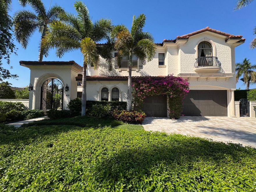 Luxury Waterfront Living in Boca Harbour! Welcome to an extraordinary waterfront estate where timeless Mediterranean elegance meets modern luxury in the prestigious community of Boca Harbour. Perfectly positioned on approximately 83 feet of frontage with direct ocean access and no fixed bridges, this impeccably maintained residence offers the ultimate South Florida boating lifestyle. Spanning approximately 4,248 square feet, this magnificent four-bedroom home makes a breathtaking first impression with a grand domed foyer and soaring 22-foot ceilings. Natural light pours through expansive floor-to-ceiling windows, illuminating the sophisticated living room anchored by a beautifully restored limestone fireplace. The elegant dining room captures serene waterfront views, creating the perfect  setting for unforgettable gatherings. Designed for both everyday living and upscale entertaining, the first floor features a versatile office/den or guest suite with its own private entrance and a full adjacent bath. The spectacular chef's kitchen, completely redesigned in 2022, is the heart of the home, showcasing professional-grade appliances, a built-in coffee station, and an impressive 12-foot custom island ideal for hosting family and friends. The adjoining great room opens seamlessly to the outdoor living spaces, creating a true indoor-outdoor experience. Step outside to your resort-style waterfront retreat, where a sparkling pool and spa overlook the tranquil canal. The fully equipped outdoor kitchen is designed for effortless entertaining and features a professional stainless-steel grill, refrigerator, ice maker, dishwasher, cold beverage storage, and a beautifully tiled bar area. An elevator provides convenient access to the second level, where the luxurious primary suite offers a private sanctuary complete with a sitting area, elegant tray ceilings, expansive custom walk-in closets, and a fully renovated spa-inspired bathroom. Step onto your private balcony and enjoy peaceful water views. Spacious guest suites provide comfort and privacy with oversized windows, custom closets, and beautifully updated en-suite bathrooms. With significant upgrades throughout, this residence delivers the perfect blend of luxury, comfort, and peace of mind in one of Boca Raton's most desirable waterfront communities.