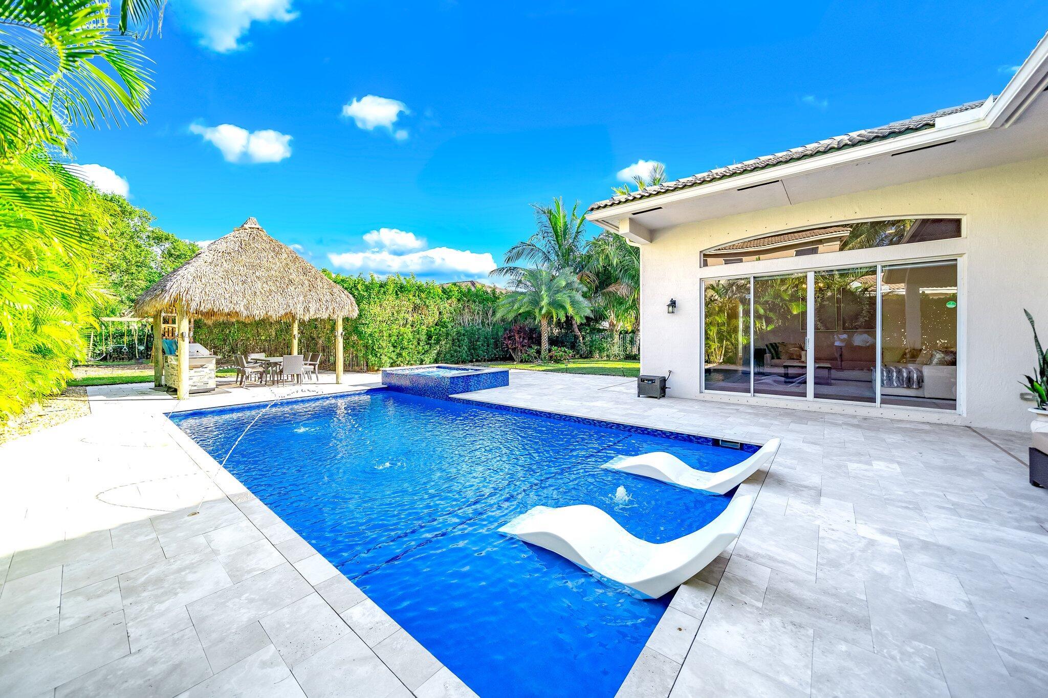 This stunning single-story 4-bedroom, 3-bathroom home, plus an office, perfectly blends comfort, luxury, and functionality. Available soon, it boasts a brand-new kitchen with sleek appliances, updated bathrooms, and elegant new flooring. The open layout creates a warm, inviting space ideal for entertaining or everyday living. The expansive backyard features a saltwater pool, jacuzzi, tiki hut, playground, and spacious patio for gatherings or enjoying the Florida sunshine. Located in a desirable neighborhood near great schools, parks, golf course, shopping, and equestrian venues, this home offers convenience and an upscale lifestyle. AVAILABLE NOW! Schedule a viewing today!