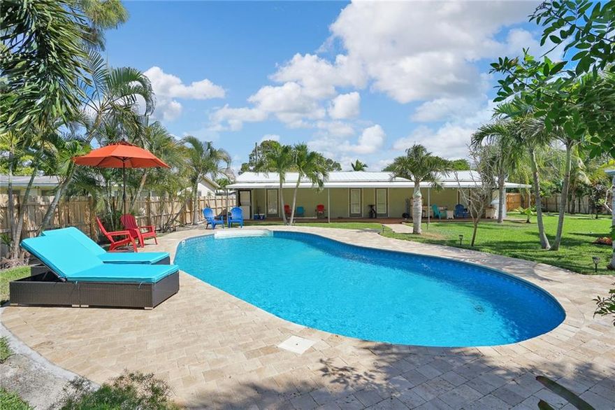 Completely remodeled unit is the 3rd unit in triplex with a pool! located at front of property and features travetine floors, Fully equipped kitchen has stainless steel appliances, granite counter-tops, recessed lighting, safe for personal items, and washer/dryer. Exterior features include a private deck & covered patio with bbq, stunning tropical enclave, lush landscaping surrounding a breath-taking shared pool, hammock, and a fire pit.