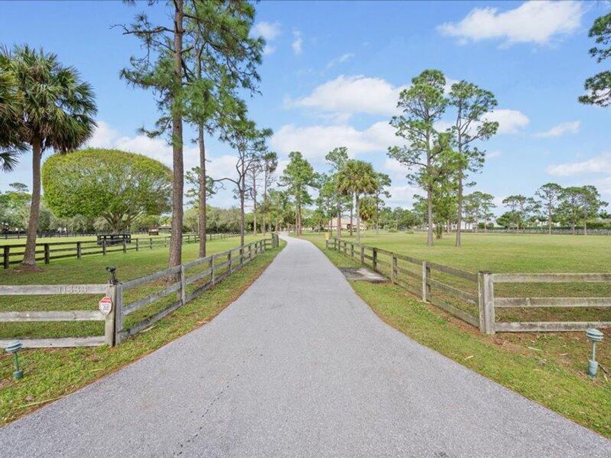 Stunning equestrian estate right in the heart of Wellington! Surrounded by world class equestrian facilities, this 9 acre property offers a spacious 4 BR / 3.5 BA home with high vaulted ceilings, fireplace, large covered and screened patio and heated pool with spa and whole house generator. The 4 stall barn has a tack room, storage area and wash rack. There are 4 large paddocks with mature shade trees, three-board fencing and run-ins. Adjacent to the barn is a 2 BR / 1 BA apartment with a living room, kitchen, patio and workshop. Little Ranches is an equestrian community close to shopping, restaurants, all of Wellington equestrian venues and PBIA airport. Plenty of room for a covered arena!