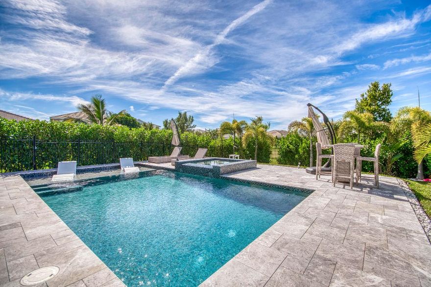 This breathtaking 2023 GL Home in Arden is one of a kind, a spacious 5 bedroom, 4.5 bath residence with a loft and den, offering both luxury and versatility. This home features  a private pool and hot tub, and a rare first-floor bedroom with a full bath, closet, and private entrance, ideal for guests, multi-generational living, or a private office. The open-concept design showcases a gourmet kitchen complete with a built-in gas range, dual ovens, and a large island overlooking the backyard oasis. Upstairs, luxury vinyl plank flooring runs throughout, including the expansive primary suite with pool views and a spa-like bathroom with both a tub and separate shower. Enjoy indoor-outdoor living with the screened-in lanai and retractable electric screen, while the heated saltwater pool with sun shelf and spa sets the stage for unforgettable evenings. This home faces east and west for stunning sunrise and sunset views.  Additional highlights include porcelain tile in main areas, a dedicated den/home office, and energy-efficient features. Located in the family-friendly community of Arden, offering new amenities like Saddle View Elementary, and a new amenity center with lap pool, pickleball, skate park, and dog park. Photos Coming Soon!