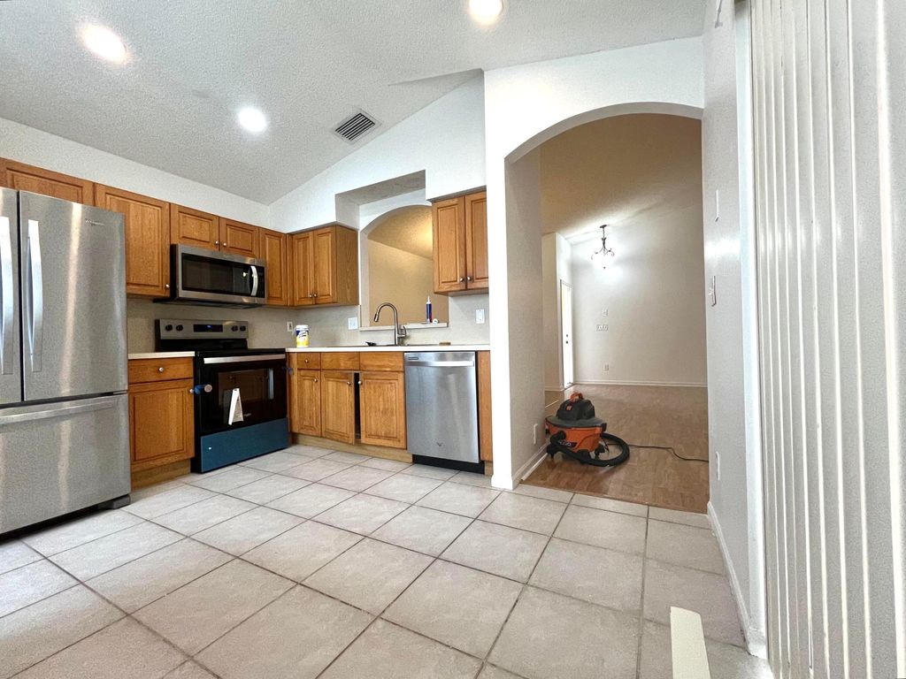 Photo of 7063 Burgess Drive, Greenacres, FL 33467 (MLS # B26034899)