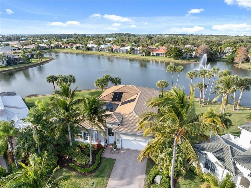 What you've been waiting for! Exceptional waterfront property completely remodeled & reimagined with special separate in-law cabana house. Alluring, expansive water views (167' along back). Artistically detailed 4BD/4BA including exceptional millwork/crown moldings throughout, custom built-ins, plantation shutters, electric window blinds, pop-up phone charger, screened porch, & VIEWS! Solar panels on roof, heated salt water pool with fountain, outdoor shower, oversized lot. Granted beach & lagoon dock access, tennis/pickleball courts, fitness ctr, 2 clubhouses with pools. A home for everyone!