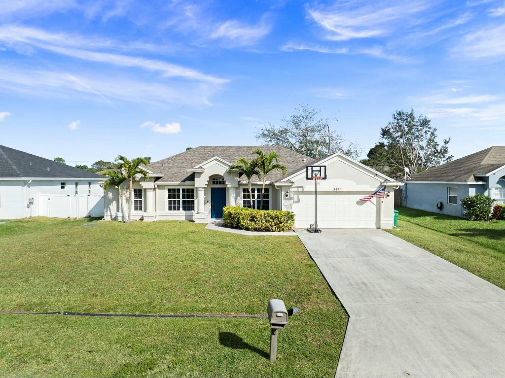 Photo of 3871 SW Ridley Street, Port Saint Lucie, FL 34953 (MLS # R11052040)
