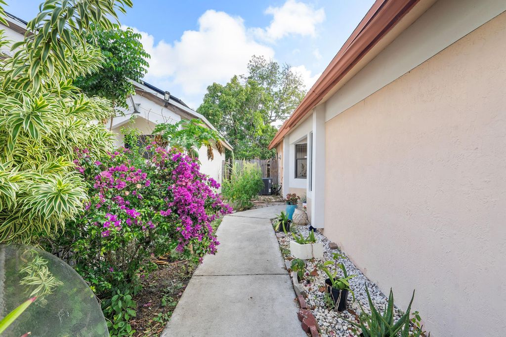 Photo of 904 Magnolia Avenue, North Lauderdale, FL 33068 (MLS # B26018608)