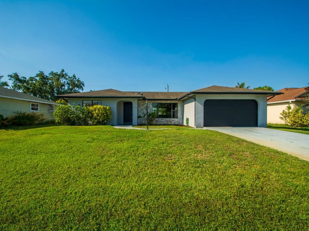 Photo of 634 SE Streamlet Avenue, Port Saint Lucie, FL 34983 (MLS # R10801209)