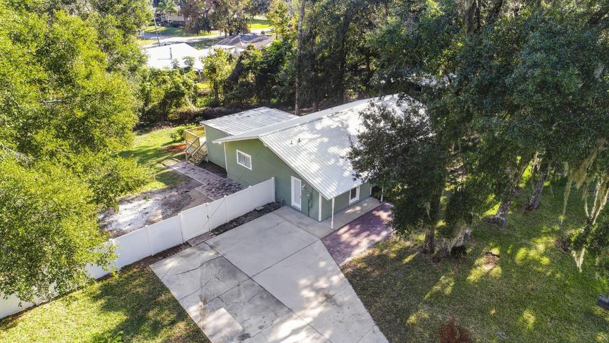 3/2.5 1752 finished SqFt Located in St Augustine south neighborhood.  Enjoy the quite shady streets great for walking and biking.  New metal roof (2025) fresh paint and new back deck.  Over sized lot, (4 lots total two buildable)  Room for a large pool or shop.  Close to boat ramps and parks.  Home is easy to show and seller says bring offers.