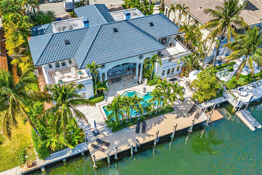 Wake up to serene east-facing views in this 5,700-sq-ft waterfront residence in prestigious Nurmi Isles with 100' of deep-water dockage. Renovated to achieve timeless sophistication and a coastal charm while incorporating modern comforts. The first-floor primary suite features a private loggia overlooking the pool, fountains, and wide waterway—an ideal outdoor retreat. Expansive interiors include generous living spaces, a wood-burning fireplace, 5 bedrooms, 5 full baths, and 2 half baths, plus multiple courtyards and private terraces. Additional features include a 3-car garage, outdoor gazebo with bar, and ample storage. An excellent location just blocks from the beach, Las Olas, dining, shopping, and galleries, with parks, Brightline, and Fort Lauderdale airport only minutes away.