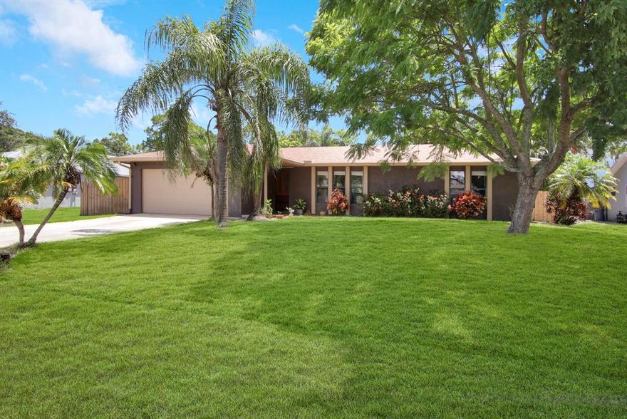 Look No Further. Meticulously Maintained and Move in Ready! 3 bedroom 2 bathroom POOL home. Roof installed in 2018. Privacy Fence Installed 2021. Hot Water Heater Installed 2018. Freshly Painted Exterior. Kitchen Features Stainless Appliances, Quartz counters, and Tiled Back Splash.Laminate and tile flooring throughout. No Carpet! Vaulted Ceilings. Huge Bedrooms with Walk in Closets. Refinished tubs and newer vanities in bathrooms. Enjoy Florida Living with an expansive backyard featuring a screened-in solar heated saltwater pool, covered lanai, newer sod, lush landscaping, and a brand new privacy fence! Newer pool equipment too! Convenient location close to restaurants, shopping, highways, and Tradition. Don't Miss Out! Schedule a showing today!