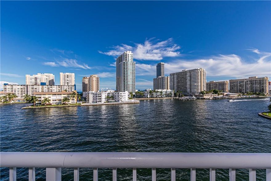 BRING YOURS FUSSIEST BUYERS! Impeccable 4th Flr. corner remodeled WITH PERMITS, sold FURNISHED, TURNKEY! Sellers spare no expense, upon entering this gorgeous condo you'll notice the seller attention to detail at every glance. Get that ''CRUISING '' feeling & watch the boat go by on the Intercoastal. The kitchen and baths have been extensively remodeled with the latest trends & style in 2013. Coffered, stretch ceiling with recessed lighting that will leave you breathless day & night! Open gourmet kitchen with huge island perfect for entertaining. Wine cooler. 16 x 32 porcelain tile. Electric blinds. Central Vacuum. New A/C, W/H, electric panel. Impact windows/doors. Washer inside unit. 40 yrs. done. Well maintained bldg. Amenities: pool, gym, BBQ, billiard, recreation rm. 1 MI. from beach.