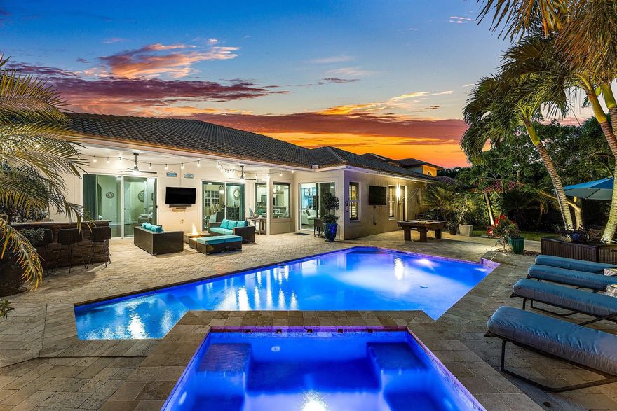 Welcome to this stunning single-family residence located in the prestigious gated community of Rialto in Jupiter, Florida. This elegant home features 4 bedrooms plus a private office/den, offering over 3,300 sq ft of thoughtfully designed living space that blends comfort, sophistication, and functionality.Step inside to an open, airy floor plan with 10-ft ceilings, designer finishes, and abundant natural light. The updated gourmet kitchen showcases new stainless steel appliances, granite countertops, and ample cabinetry--perfect for both everyday living and entertaining. The resort-style backyard features a custom heated pool and spa with dramatic fire features, and a fully equipped outdoor kitchen, whole house generator, and much more!  See supplement for additional features.