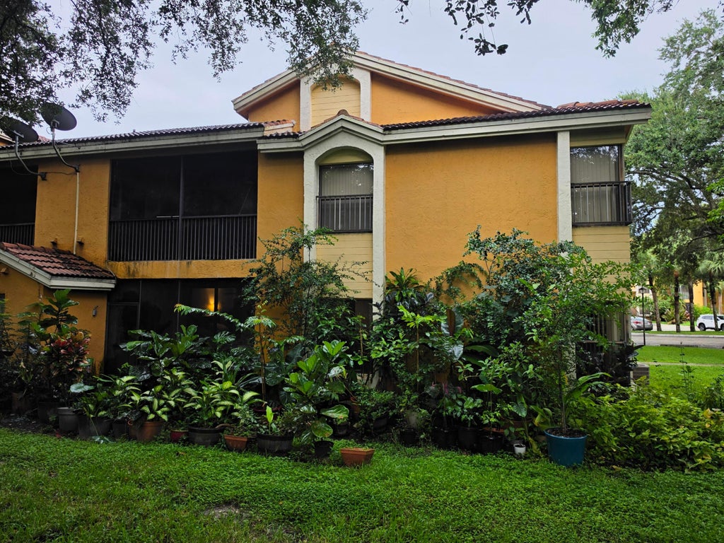 Photo of 3852 Coral Tree Circle, Coconut Creek, FL 33073 (MLS # B26075106)