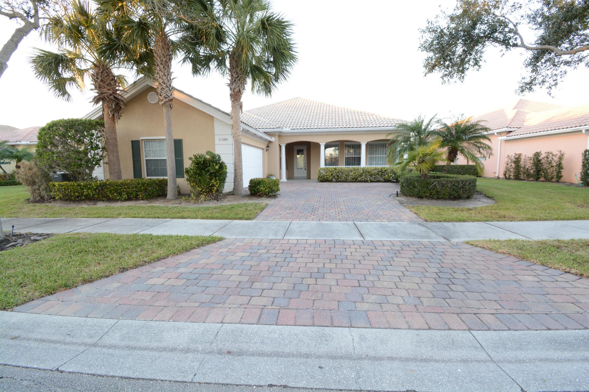 Beautiful home in gated Tradition with spacious floor plan that is split 3 ways! It has a beautiful lake view from several rooms including main bedroom, kitchen and family room. Neutral grey wood-look ceramic tile throughout for simplicity in cleaning and decor. No carpet! Lots of closets and storage space including built in cabinetry in family room. Half bath is included in the primary bathroom. The community offers two pools, tennis and basketball court, pickle ball, playground, dog park and so much more. HOA includes: internet, lawn maintenance, cable, and security maintenance. Home is located close to shops and restaurants. All measurements/fees to be verified, not guaranteed.
